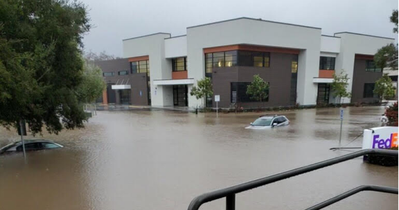 Flooding in parking lot on Sacramento Drive in SLO.png